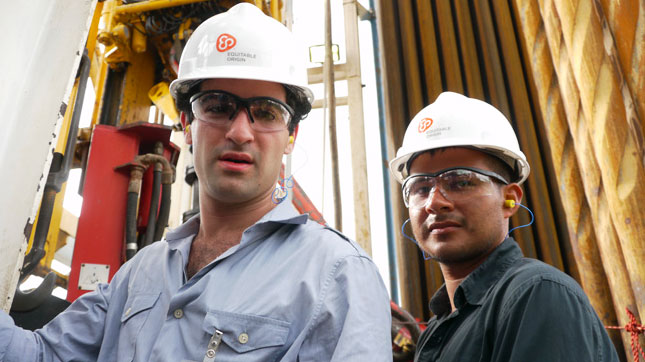 David Poritz (left) and Hugo Lucitante visit a Petroamanas oil field in Ecuador.