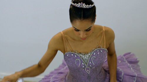 ballerina Misty Copeland in purple ballet costume 