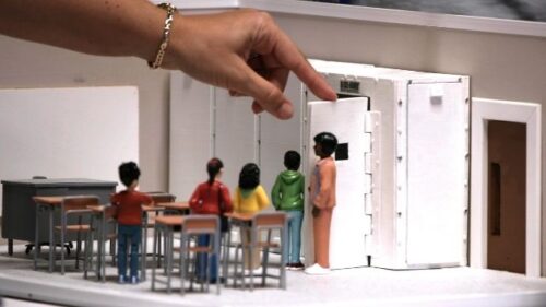 figurine children doing a lockdown drill in a classroom