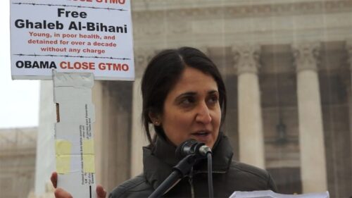 woman outside courthouse giving a speech