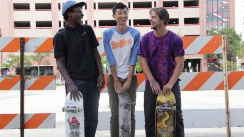 friends Bing, Keire and Zack with skateboards 
