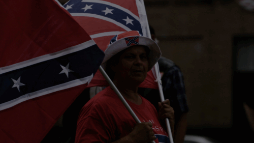 A protestor from the League of the South in front of the Robert E Lee monument in New Orleans
