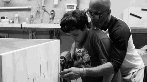 casket maker teaching child
