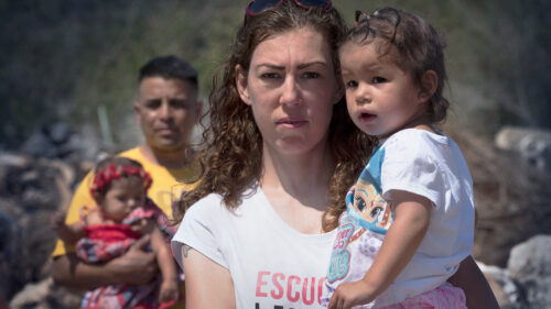 veteran Elizabeth and husband Marcos holding their daughters