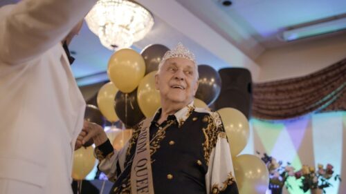 Rev. Robert Clement, a resident at the Los Angeles LGBT Center's Triangle Square, is crowned prom queen at the annual Senior Prom.