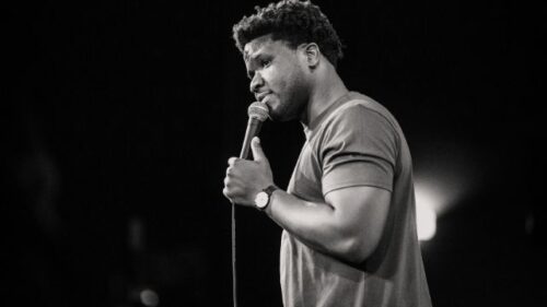 Black and white photo of comedian, TJ (Tanael Joachim)