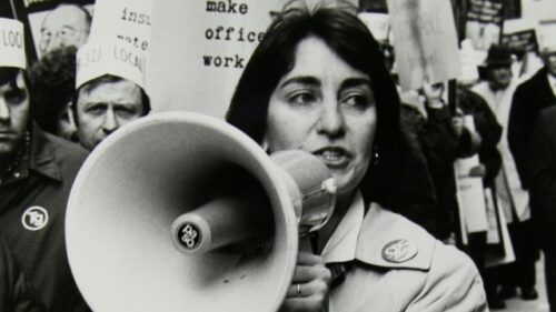 women protestor holding a megaphone