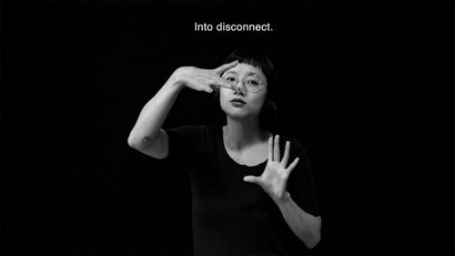 Woman using sign language (stylized) with text above her head 'into disconnect'
