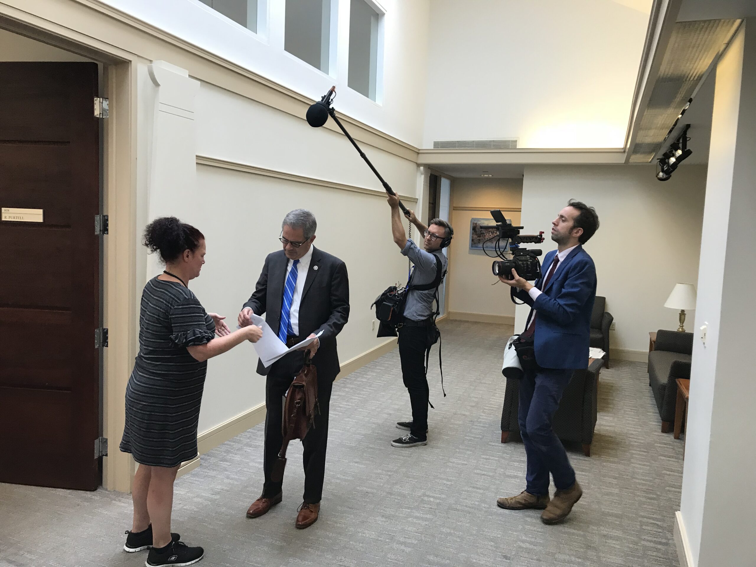 : Philly D.A. directors Ted Passon and Yoni Brook film District Attorney Larry Krasner during a meeting [Credit: Nicole Salazar]