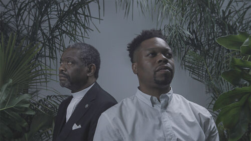 two men looking in different directions