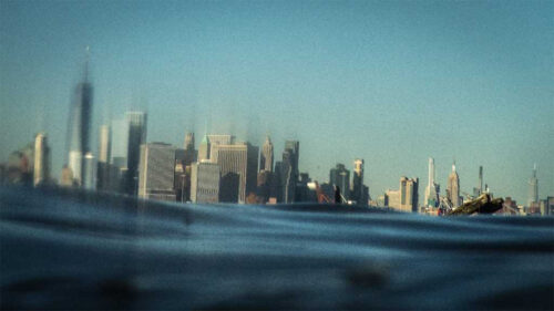 nyc skyline with water in the foreground