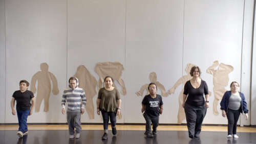 six dwarfs standing in a line facing the camera standing in a line