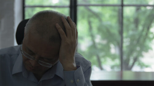 Man with his head in his hands