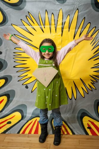 A young superheroine at the “Wonder Women! The Untold Story of American Superheroines” event at the Chicago Cultural Center.