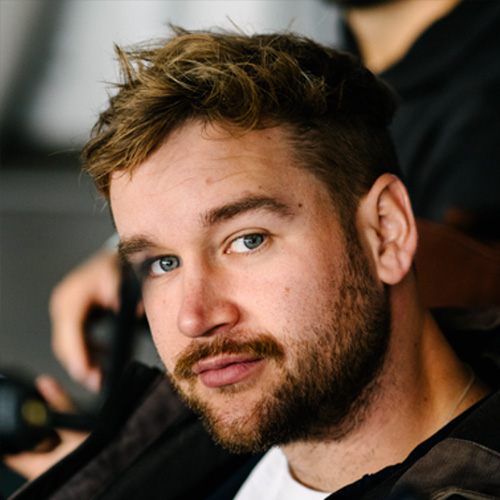 Headshot of man with blond hair and blue eyes
