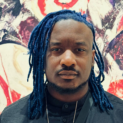 Headshot of man with dark dark sink tone