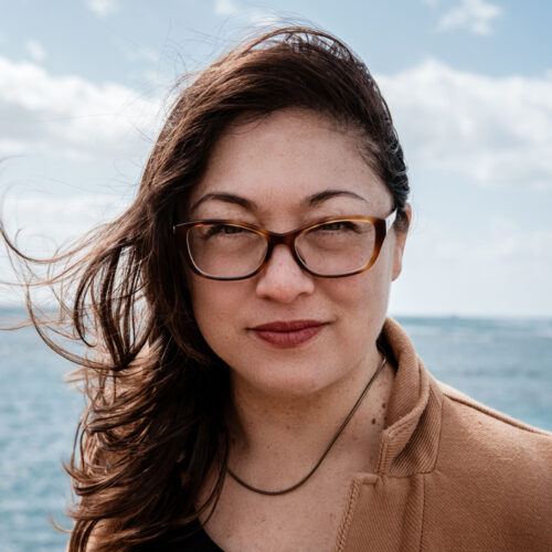headshot of woman with medium light brown skintone