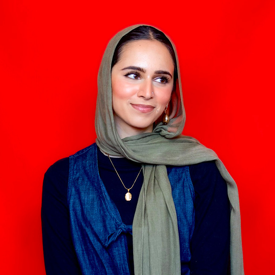 headshot of woman hearing a hijab with light skintone and hark hair, eyebrows and eyes